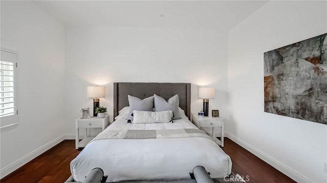 bedroom featuring dark hardwood / wood-style flooring