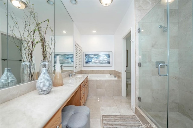 full bathroom featuring tile patterned floors, toilet, vanity, and shower with separate bathtub