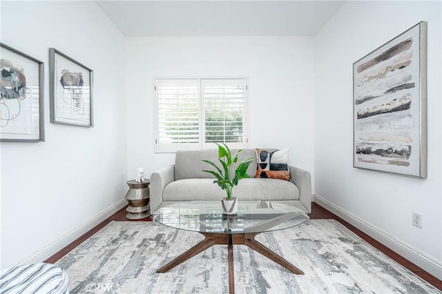 sitting room with hardwood / wood-style flooring