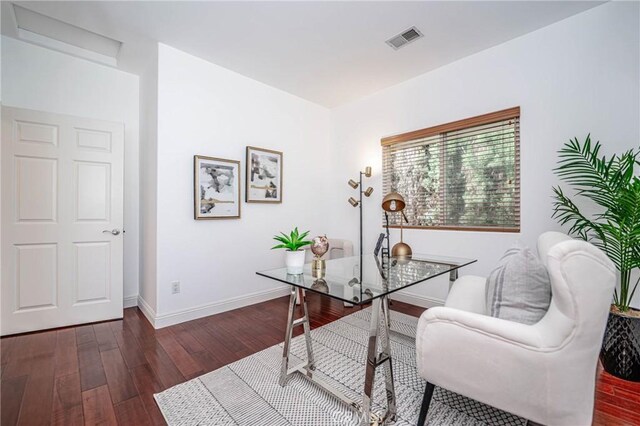 office with dark hardwood / wood-style flooring