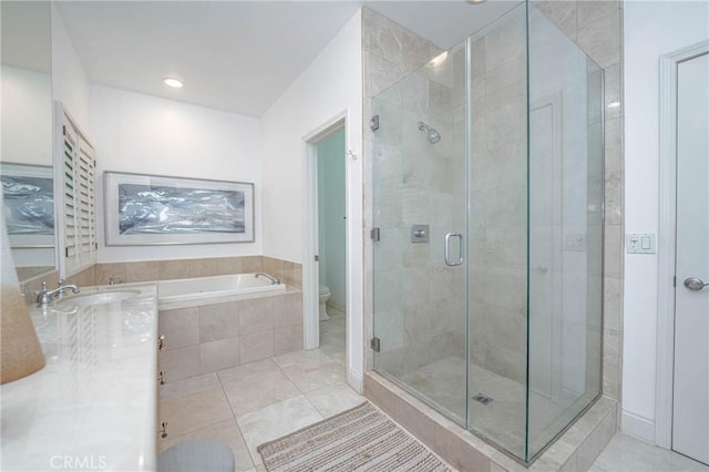 full bathroom with toilet, tile patterned floors, independent shower and bath, and sink