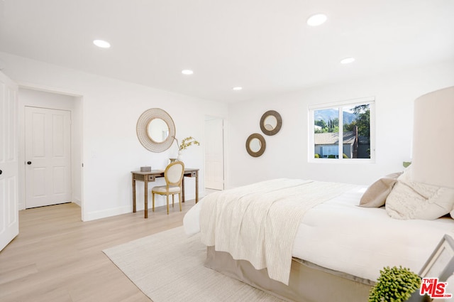 bedroom featuring light hardwood / wood-style floors