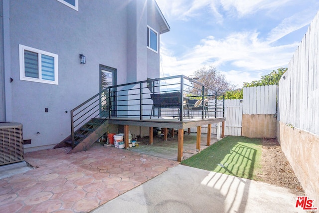 exterior space featuring a patio, central AC unit, and a wooden deck