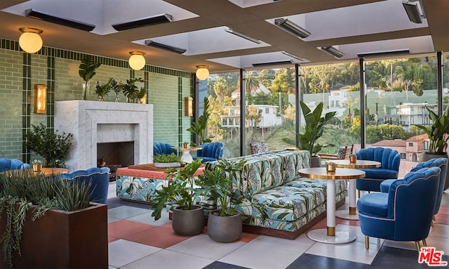 sunroom / solarium with exterior fireplace