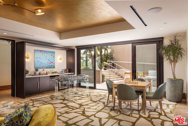 dining area featuring a tray ceiling