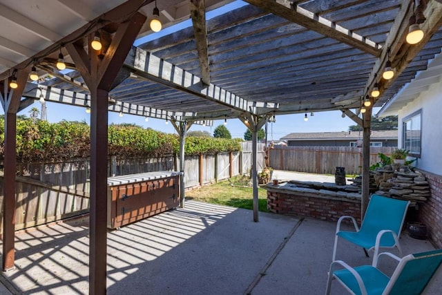 view of patio / terrace with a jacuzzi and a pergola