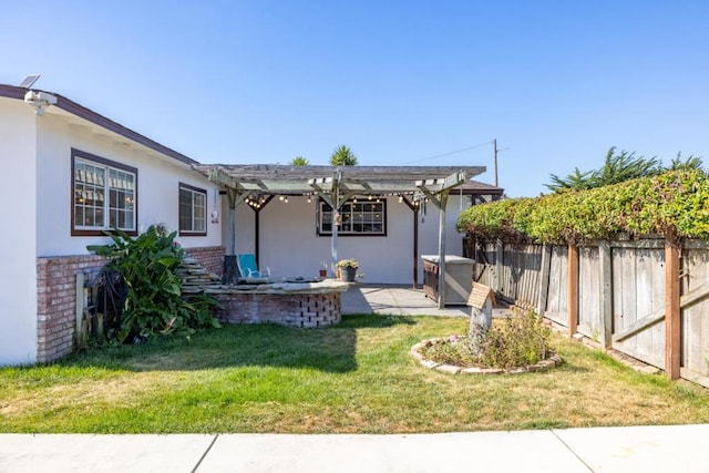 exterior space with a yard, a pergola, and a patio