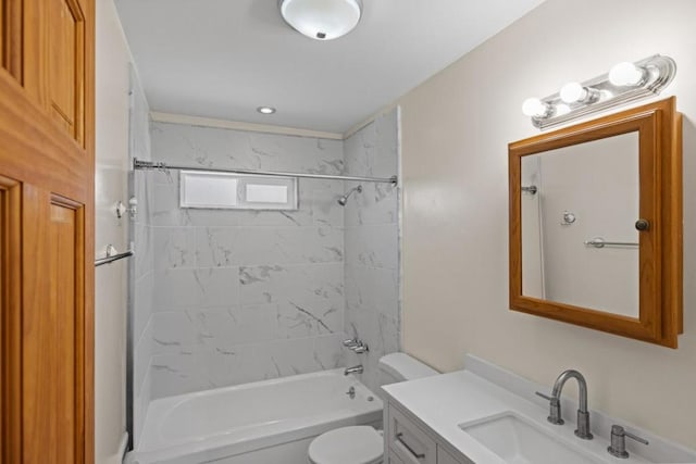 full bathroom with vanity, toilet, and tiled shower / bath combo