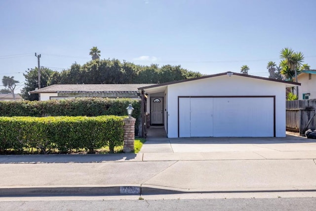 single story home featuring a garage