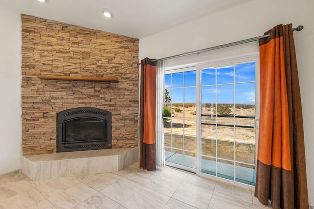 unfurnished living room featuring vaulted ceiling