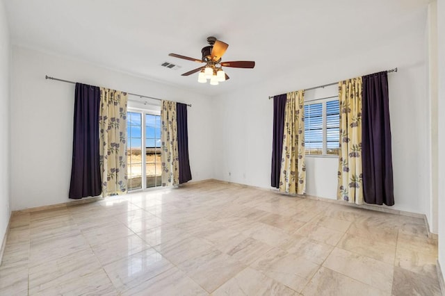 spare room featuring ceiling fan