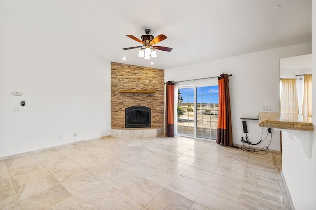 unfurnished living room with a stone fireplace, ceiling fan, and vaulted ceiling