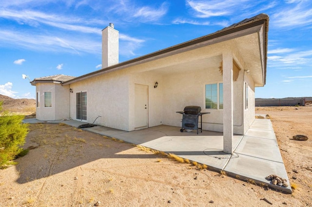 rear view of house with a patio