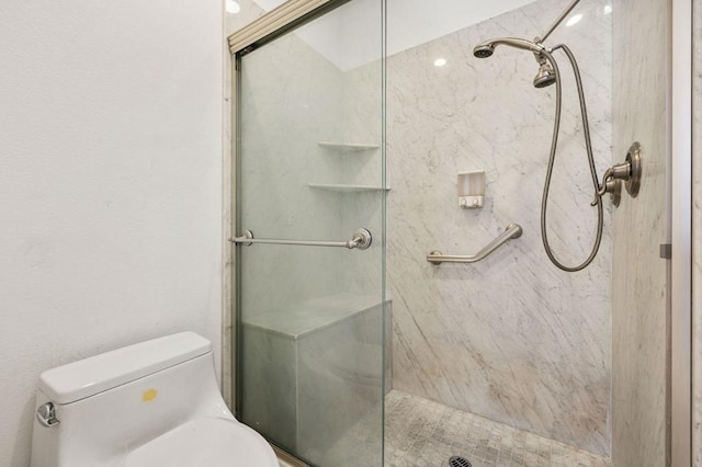 bathroom with toilet and walk in shower