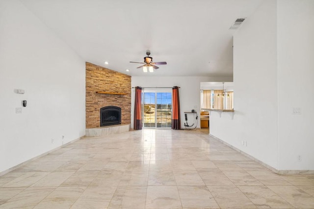 unfurnished living room featuring a fireplace, ceiling fan with notable chandelier, and vaulted ceiling