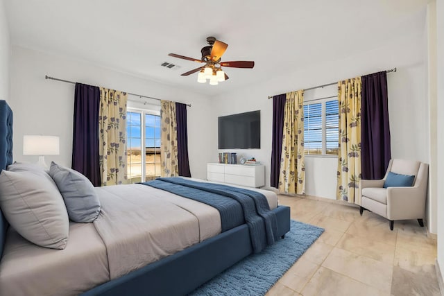 tiled bedroom with access to exterior and ceiling fan