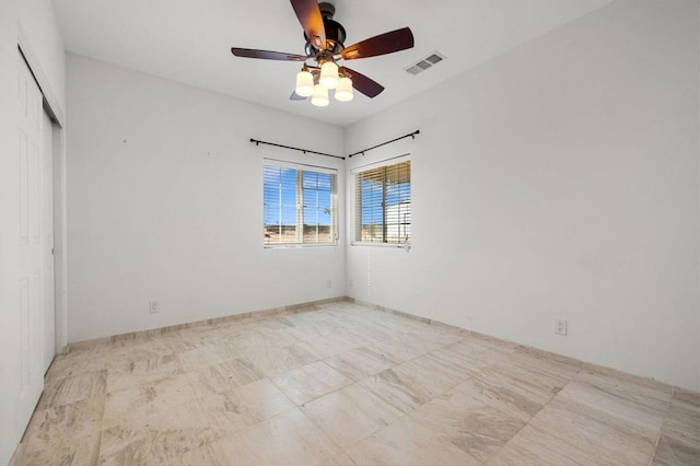 unfurnished room featuring ceiling fan