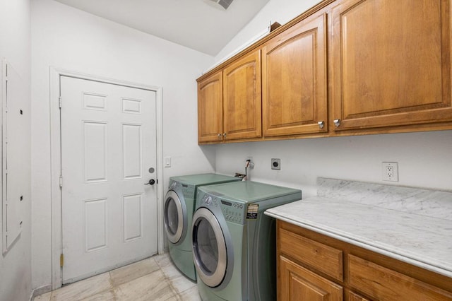 laundry area featuring cabinets and independent washer and dryer