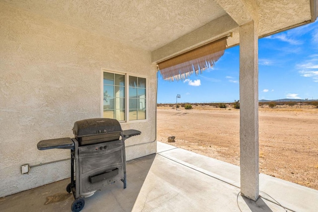 view of patio with a grill