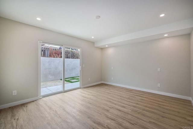 empty room with light hardwood / wood-style floors