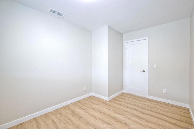 unfurnished room featuring light hardwood / wood-style floors