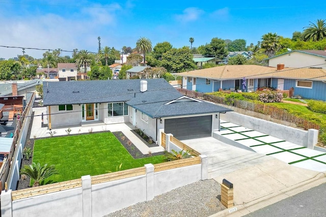 view of front of house with a front lawn and a garage