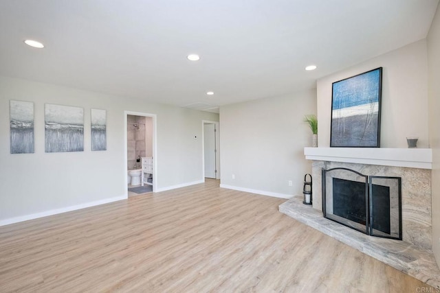 unfurnished living room with light hardwood / wood-style flooring