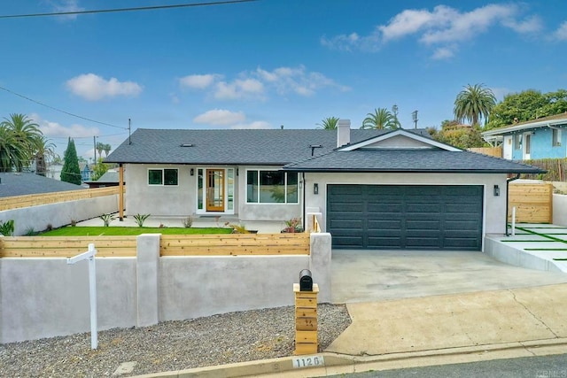 ranch-style house featuring a garage