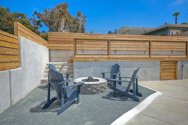 view of patio with a fire pit