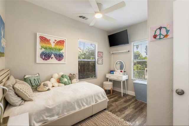 bedroom featuring ceiling fan and dark hardwood / wood-style floors