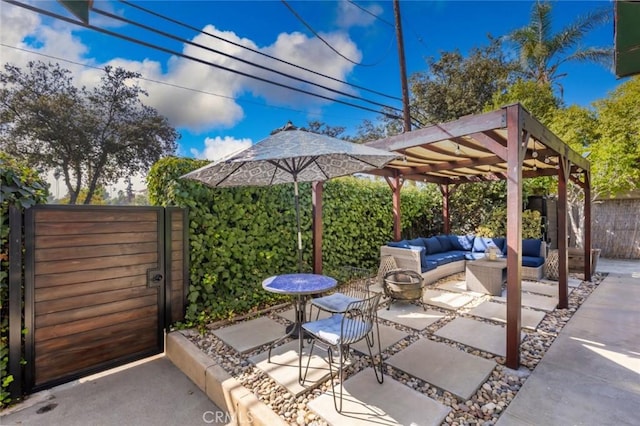 view of patio / terrace with an outdoor living space with a fire pit and a pergola