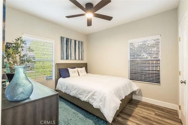 bedroom featuring ceiling fan and hardwood / wood-style flooring