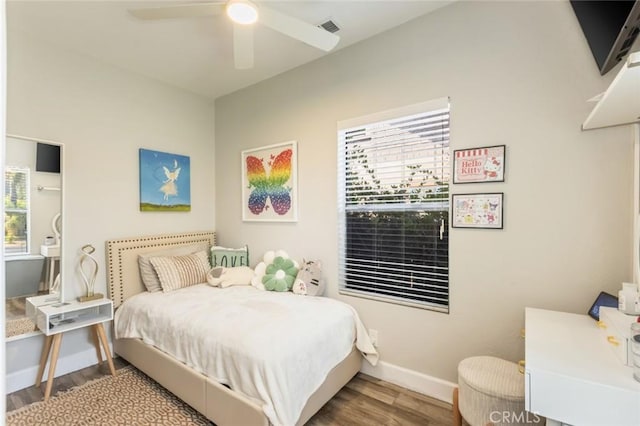 bedroom with ceiling fan and hardwood / wood-style floors