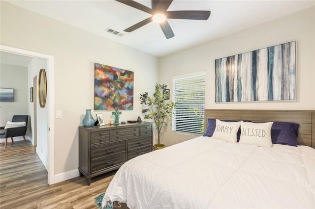 bedroom featuring ceiling fan and light wood-type flooring