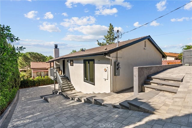 back of property featuring a patio area