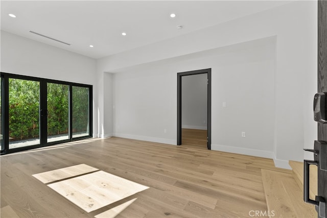 unfurnished living room featuring light hardwood / wood-style floors