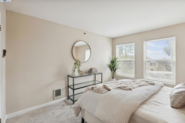 bedroom with light carpet