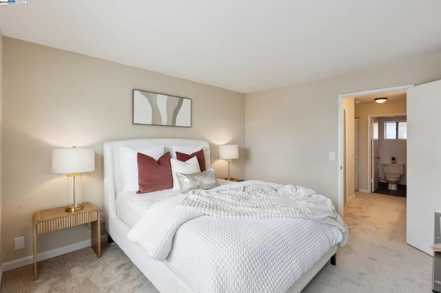 bedroom featuring light colored carpet