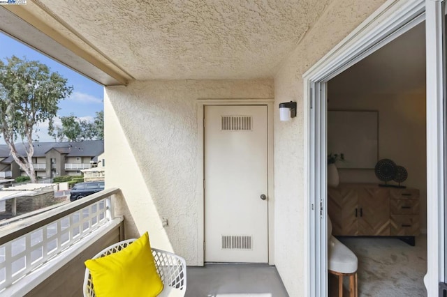 entrance to property with a balcony