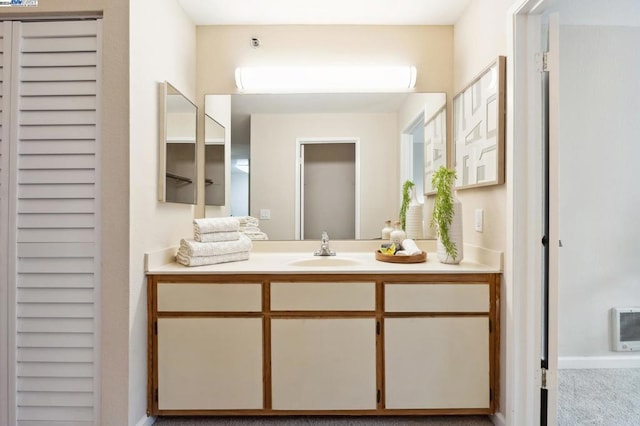 bathroom featuring vanity and heating unit