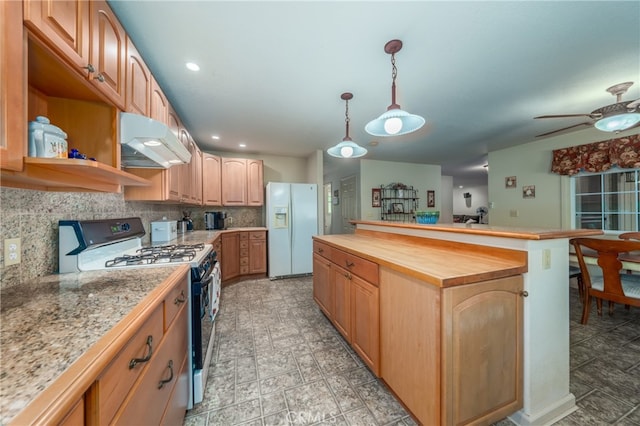 kitchen featuring wooden counters, white appliances, extractor fan, decorative light fixtures, and backsplash