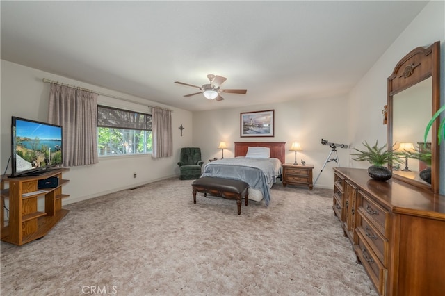 bedroom featuring ceiling fan and light colored carpet