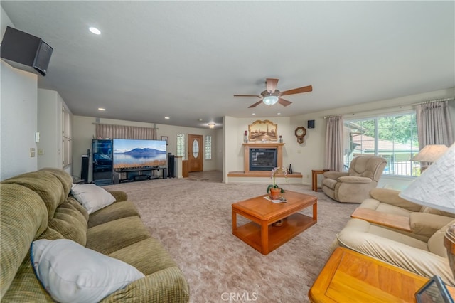 living room with light carpet and ceiling fan