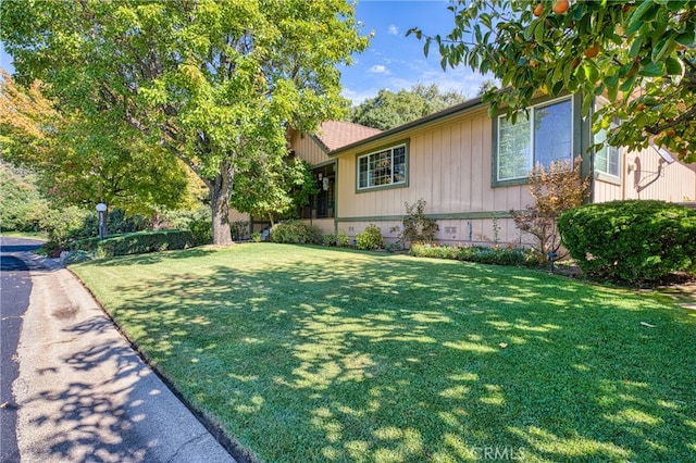 view of property exterior featuring a yard