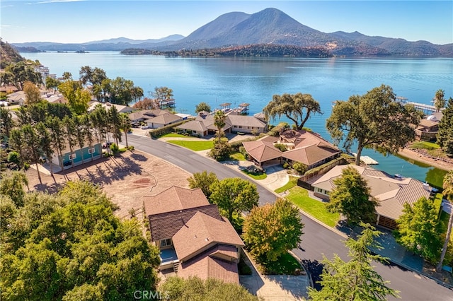 bird's eye view with a water and mountain view