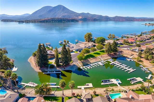 bird's eye view with a water and mountain view