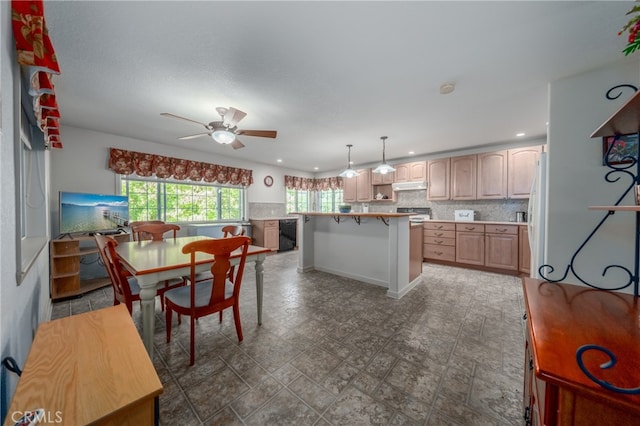 dining space featuring ceiling fan