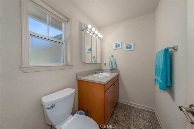 bathroom with toilet and vanity