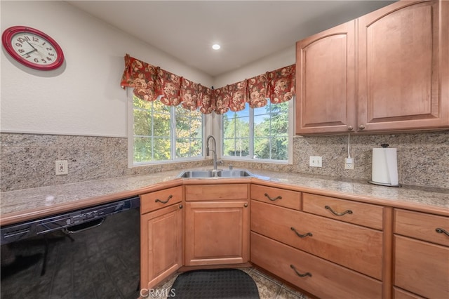 kitchen with decorative backsplash, black dishwasher, sink, and light brown cabinets