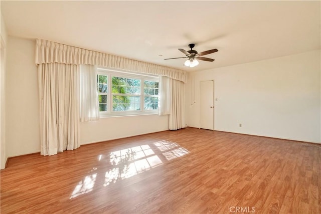 unfurnished room with ceiling fan and light hardwood / wood-style flooring